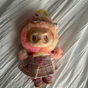 Authentic Popmart Labubu wearing “miu miu”